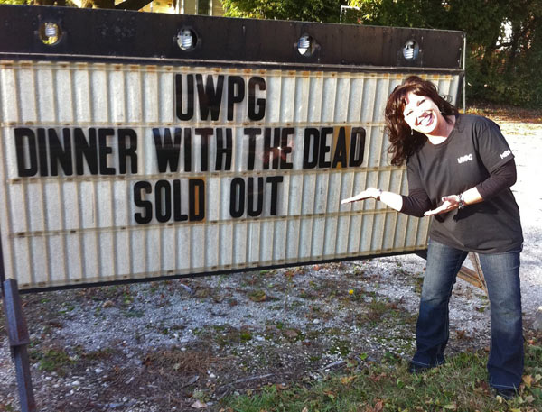 Robynne at the Dinner with the Dead sign